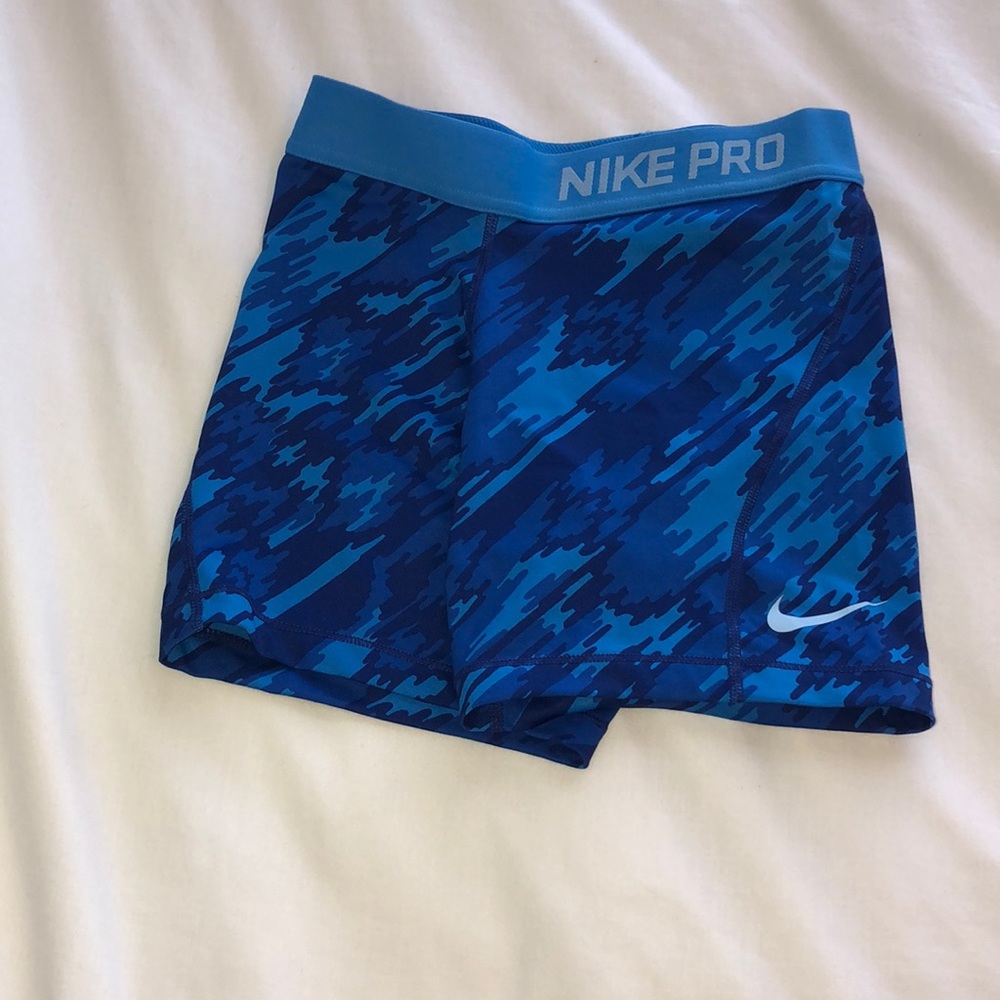 blue patterned nike pros